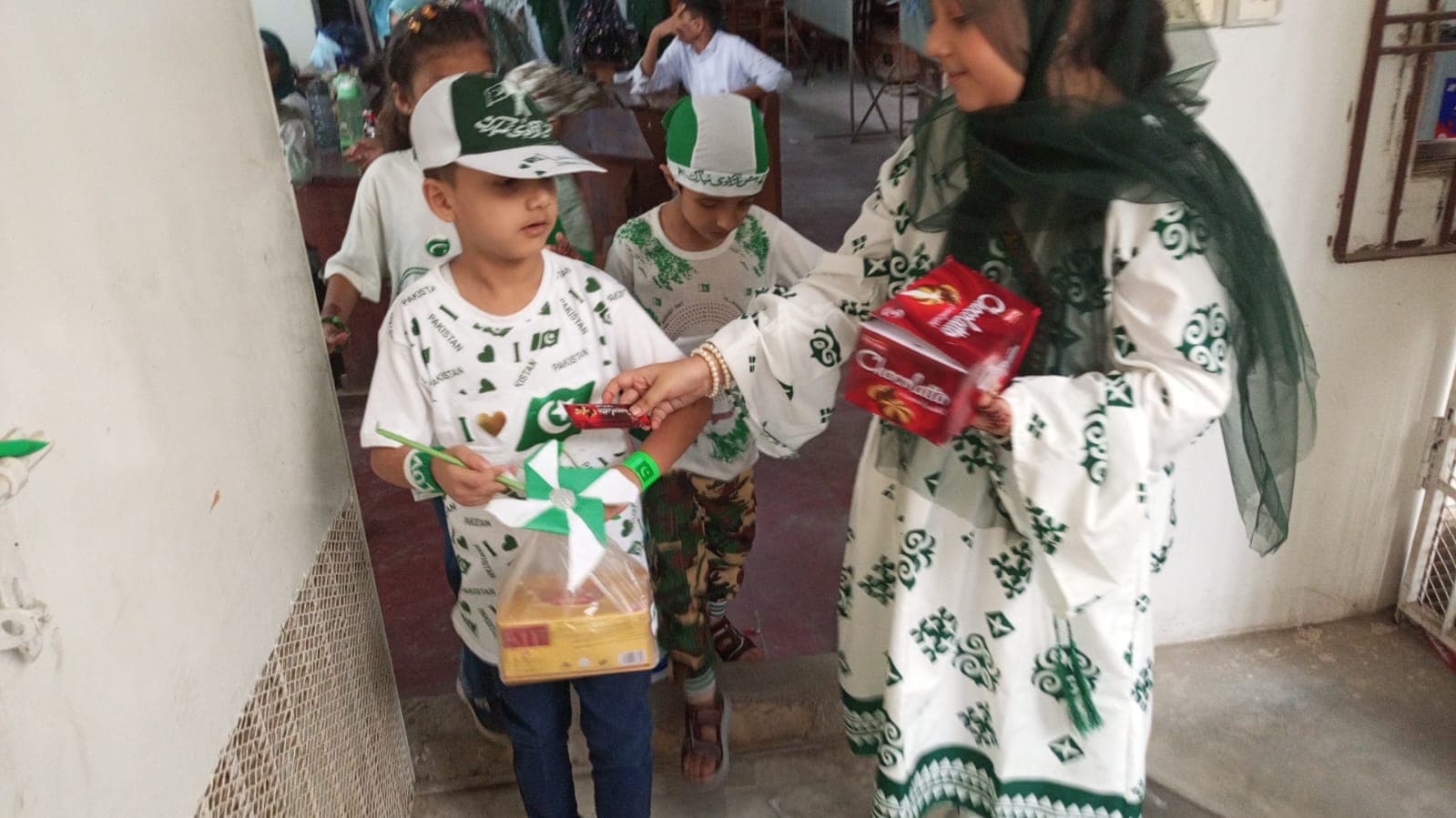 A student receiving an Independence Day gift