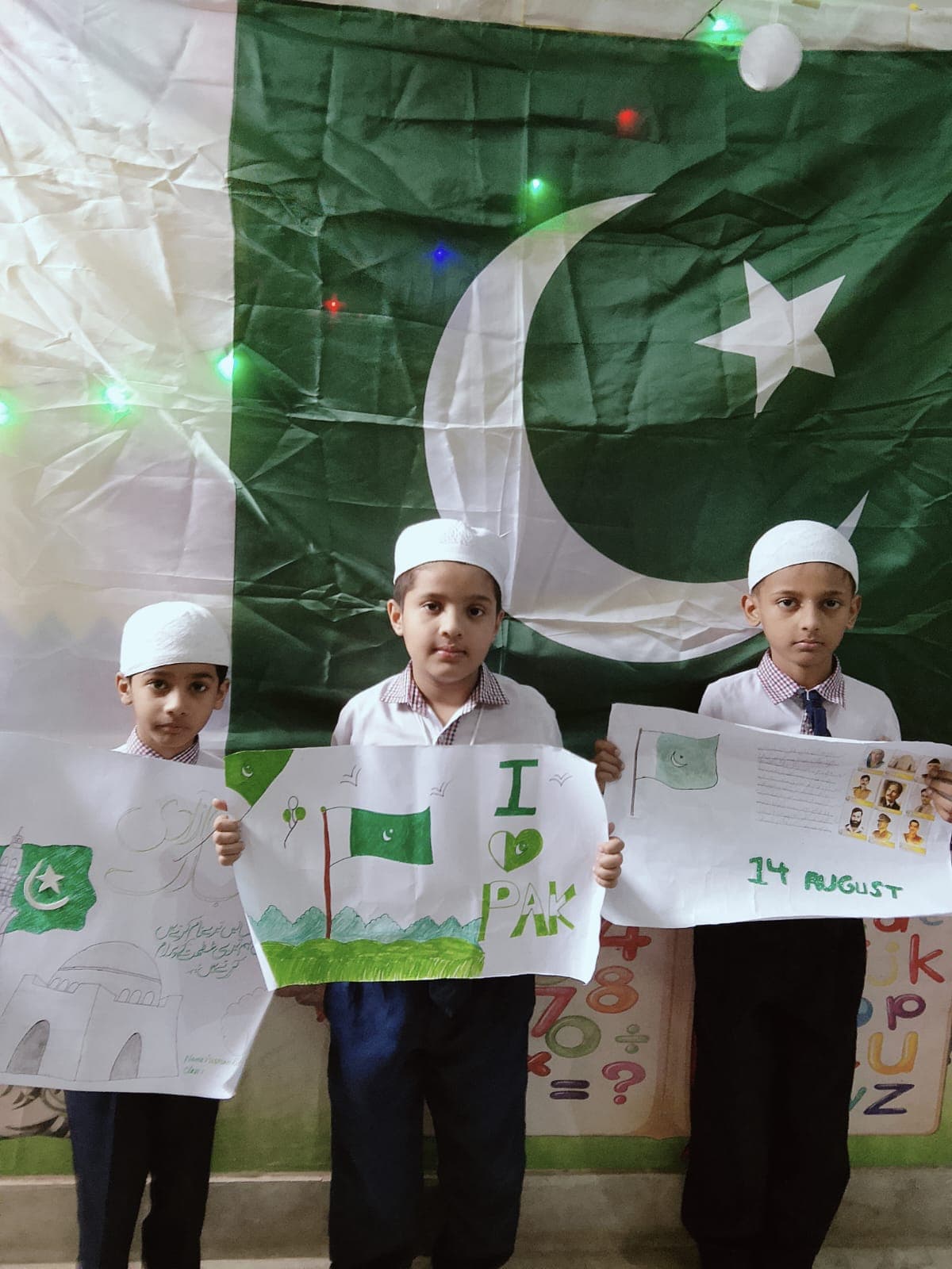Students presenting their Independence Day artwork