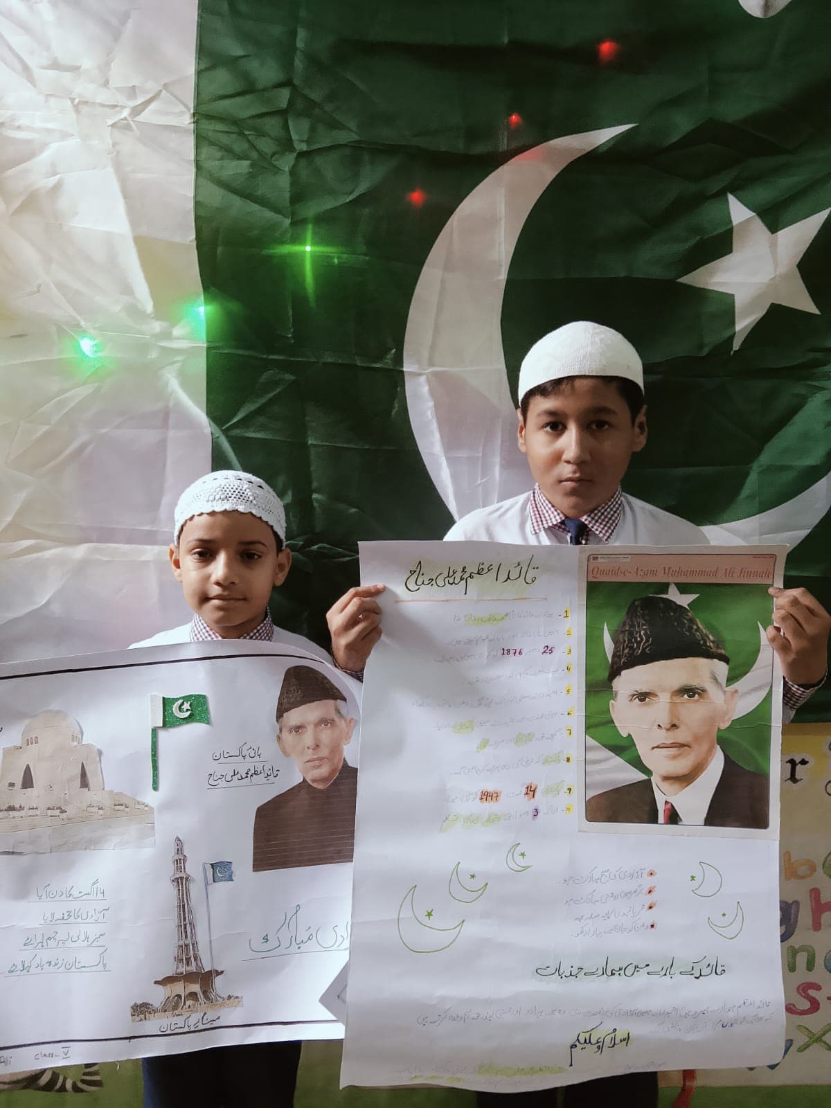 Students presenting Pakistan-themed posters
